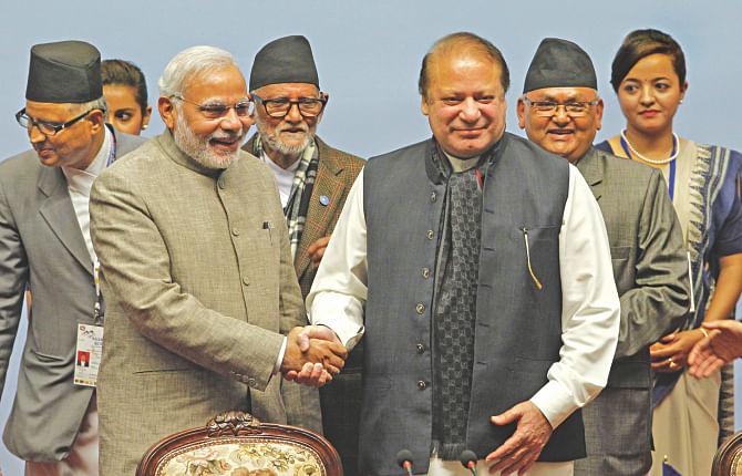 Indian Prime Minister Narendra Modi shakes hands with his Pakistani counterpart Nawaz Sharif during the closing session of the 18th Saarc summit at City Hall in the Nepalese capital Kathmandu yesterday. Photo: AFP