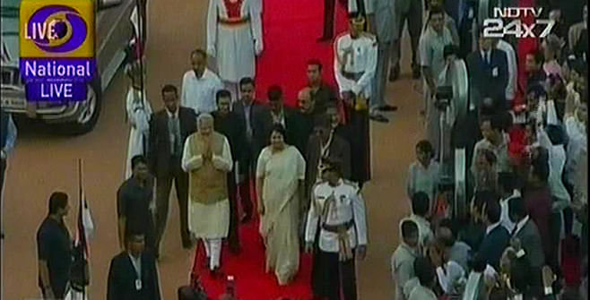 India's PM designate Narendra Modi is greeted as he reaches the Rastrapati Bhaban to take oath. Photo: TV grab