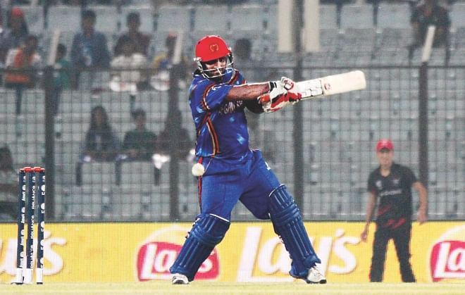 Afghanistan opener Mohammad Shahzad plays a square-cut during his 68-run knock in their first round match of the World Twenty20 against Hong Kong at the Zohur Ahmed Chowdhury Stadium in Chittagong yesterday.  PHOTO: ANURUP KANTI DAS