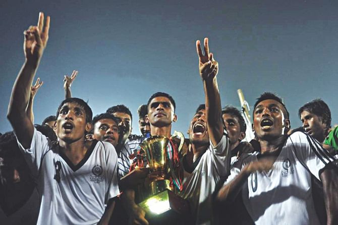 TEENAGE TRIUMPH: Mohammedan Sporting Club's youngsters celebrate after winning the Airtel U-18 Football Tournament yesterday. They beat Brothers Union 2-0 at the Bangabandhu National Stadium.  PHOTO: STAR