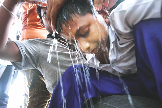 At one stage, Mohsin, one of the students demonstrating even in the scorching heat, fell sick and later was taken to a hospital. Photo: Palash Khan