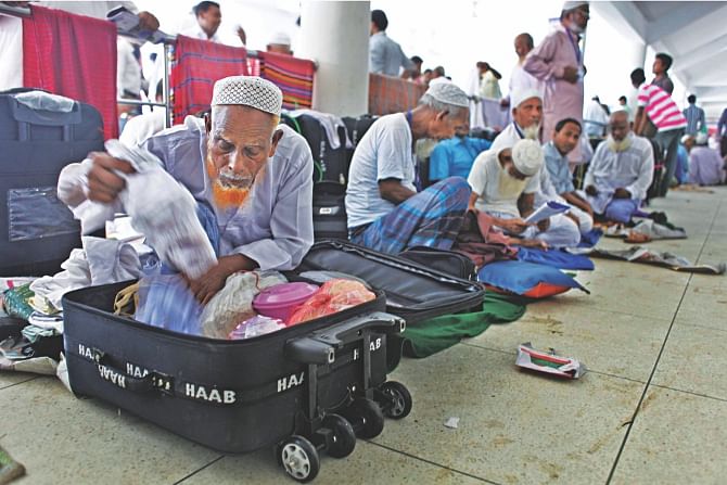 Seventy-five-year-old Montaz Hossain, left, from Lalmonirhat, has been at Ashkona Hajj camp in the capital since Friday. A Hajj agency cheated him and nine others of their money having promised them visas and air tickets. Photo: Rashed Shumon