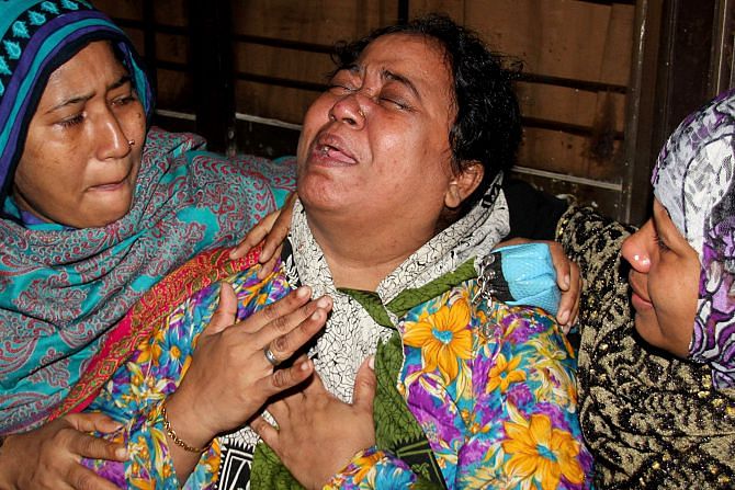 Mother of Sanjid Hossain Ovi, who died from bomb blast, cries her heart  out at the Burn Unit of Dhaka Medical College Hospital.