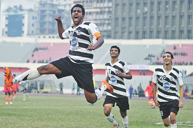 Mohammedan striker Zahid Hasan Emily (L) is elated after scoring for the third successive game in the Bangladesh Premier League during yesterday's match against Brothers Union at the Bangabandhu National Stadium. PHOTO: STAR