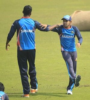 Bangladesh captain Mushfiqur Rahim (R) stretches with fast bowler Al-Amin Hossain during a practice session at the Sher-e-Bangla National Stadium yesterday, ahead of today's third and final ODI against Sri Lanka. Photo: Star