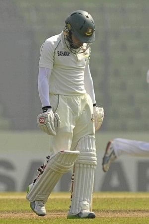 PICTURE SAYS IT ALL: Bangladesh skipper Mushfiqur Rahim bears a defeated look while walking back after being dismissed on the fourth day of the first Test against Sri Lanka at the Sher-e-Bangla National Stadium yesterday. His team were no better as they were routed by an innings and 248 runs. Photo: firoz ahmed