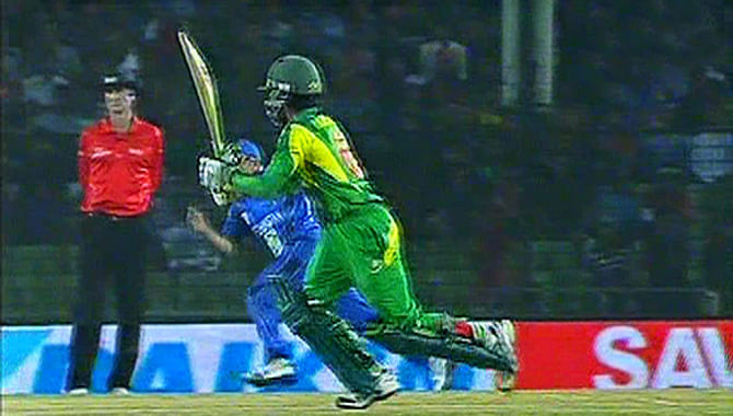 Mominul Haque hits a boundary on the leg side as Bangladesh take Afghanistan in their second match at Narayanganj Saturday. Photo: TV grab