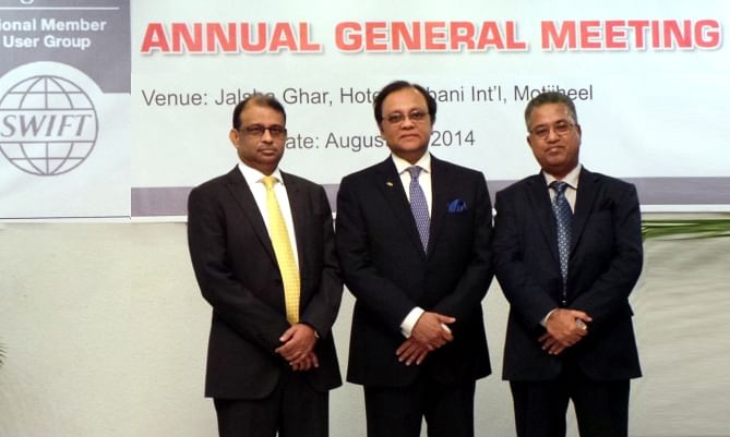 From left, Ali Reza Iftekhar, managing director of Eastern Bank; Anis A Khan, managing director of Mutual Trust Bank; and AMM Farhad, deputy managing director of Social Islami Bank, pose after the annual general meeting of SWIFT Member and User Group of Bangladesh, in the capital on Wednesday. Photo: MTB