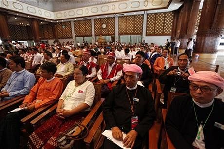 Members of Myanmar political parties attend a meeting with Myanmar President Thein Sein at Yangon region government office on Sunday in Yangon, Myanmar. Photo: AP