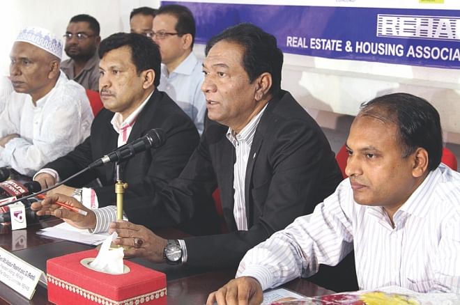 Second from right, Md Abdur Rashid, acting president of Real Estate and Housing Association of Bangladesh, speaks at a media briefing at the National Press Club in Dhaka yesterday, announcing the association's housing fair set to begin on Thursday.  Photo: Star