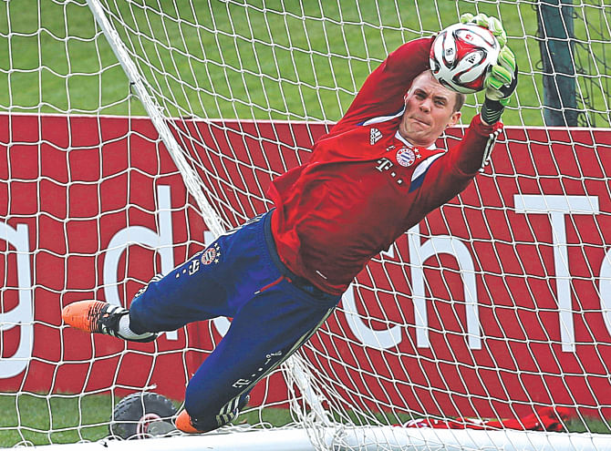 Bayern Munich goalkeeper Manuel Neuer saves a goal during a training session at the Aspire Academy of Sports Excellence in Doha yesterday. Bayern Munich are in Doha for a nine-day training camp during their winter break. Photo: AFP