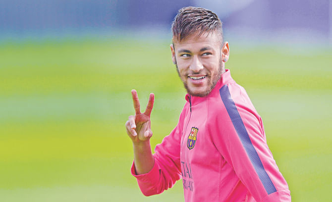 Barcelona star Neymar flashes the victory sign during a training session at the Sports Centre Joan Gamper in Sant Joan Despi yesterday. photo: AFP