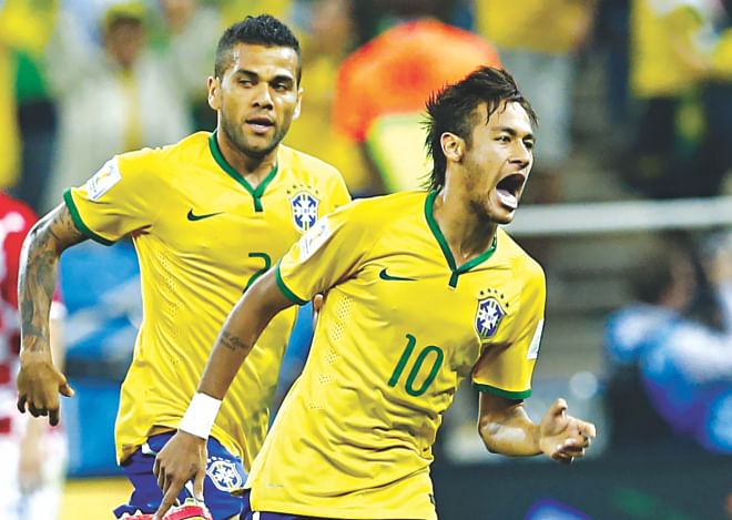 Neymar (R) has been tipped as one of the impact men in the World Cup 2014 and the Brazilian lived up to that billing. Here the striker is seen embarking on a celebratory run after his equalising goal against Croatia in the opening match at the Arena Corinthians in Sao Paulo on Thursday. Brazil won 3-1. PHOTO: REUTERS