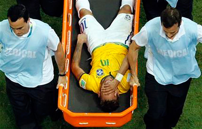 Brazil's Neymar is carried away on a stretcher during the World Cup quarterfinal soccer match between Brazil and Colombia at the Arena Castelao in Fortaleza, Brazil, Friday. Photo: AP