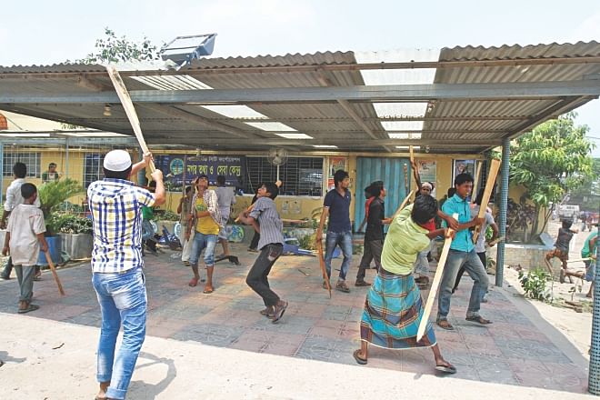 Angry locals vandalise an office of Nur Hossain. Photo: Star