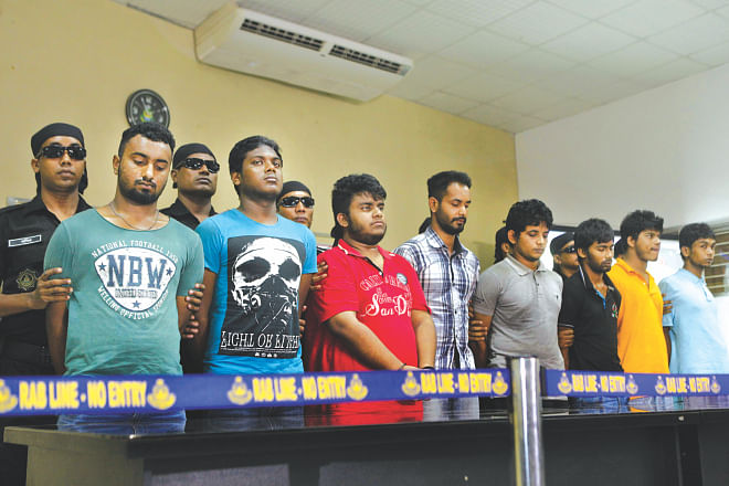 The eight people Rab arrested in connection with the murder of Phulgazi upazila chairman Ekramul Haq in Feni. The photo was taken at Rab headquarters in Dhaka yesterday. Photo: Star