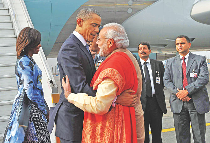 Breaking protocol, Indian Prime Minister Narendra Modi greets US President Barack Obama as the president and First Lady Michelle Obama disembark from Air Force One in New Delhi yesterday.  Photo: AFP