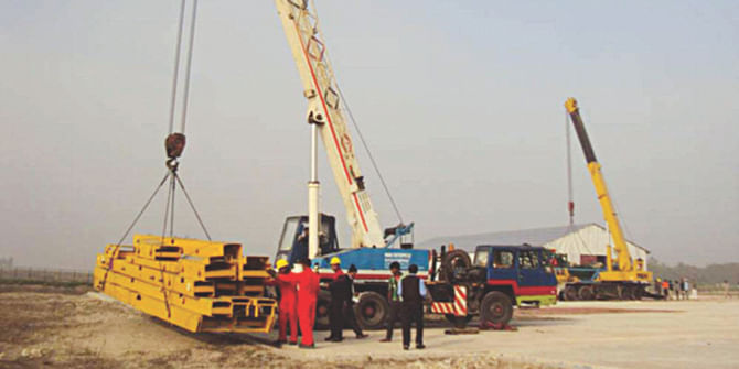 In this file photo, drilling equipment are seen kept at the prospective gas and oil site at Mubarakpur in Pabna district. 