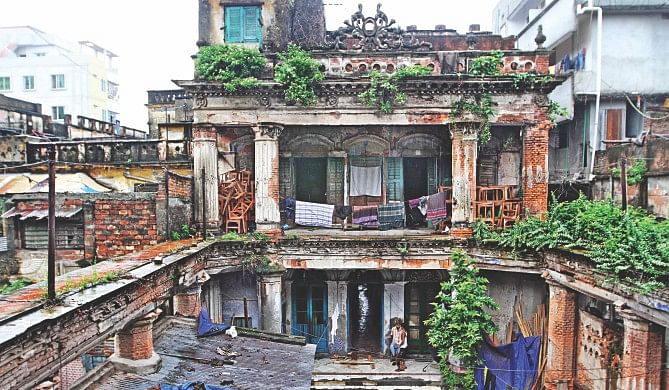 The century-old Baro Bari on BK Das Road in Old Dhaka, that used to stand out in rows of buildings for its French rococo-style design, nowadays with its flaking and crumbling walls waiting helplessly to be knocked down as the government seems reluctant to protect it while its owner wants to lease the land to a developer for profits.  Photo: Star
