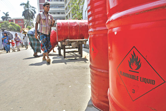 Flammable chemicals are still stored and sold from the ground floor of buildings in Old Dhaka. Apparently, the Nimtoli inferno taught people no lesson. The photos were taken near Mitford Hospital in the capital yesterday. Photo: Rashed Shumon