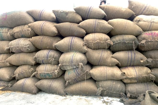 Bags refilled with 'test relief' rice from earlier season get to the government warehouse in Hakimpur upazila of Dinajpur district, along with fresh rice under the ongoing boro procurement drive although the whole amount is supposed to be collected from the recent harvest.  PHOTO: STAR