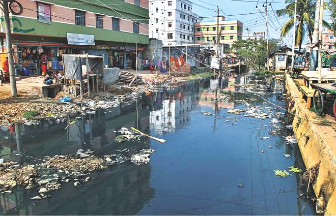 One glance at Chittagong city's Maittailla Khal, as in here in Khalpar Pocketgate, is enough to realise the indifference of the locals and the city corporation in keeping it clean and free from encroachment. The photo was taken recently. Photo: Anurup Kanti Das