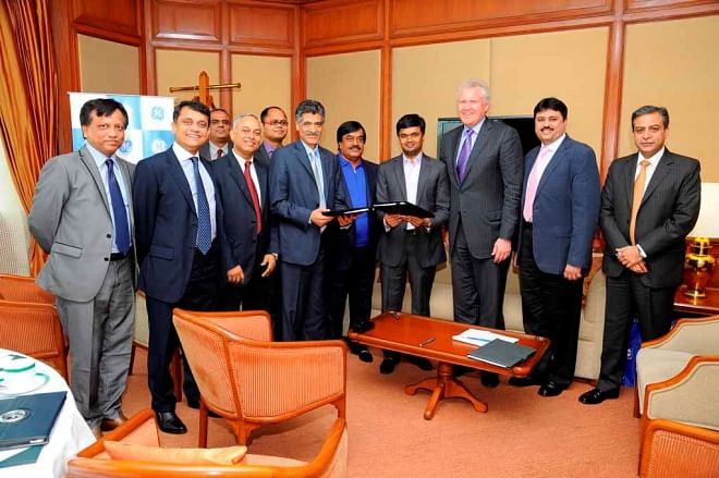 Orion Group Managing Director Salman Obaidul Karim and GE Vice-president Vishal K Wanchoo exchange documents after signing a deal in Mumbai recently. Under the deal, GE will provide a steam turbine generator worth $66 million for a power plant of Orion. GE Chairman and CEO Jeffrey R Immelt and Orion Group Chairman Mohammad Obaidul Karim were also present. Photo: Orion