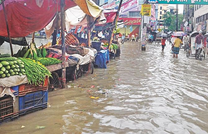 The overnight incessant rain floods Chawkbazar of Chittagong. Photo: Star