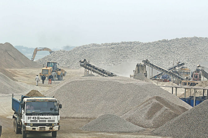 Trucks and earth-moving equipment preparing the materials for the Padma bridge at the construction site. The photo was taken recently.  Photo: Star