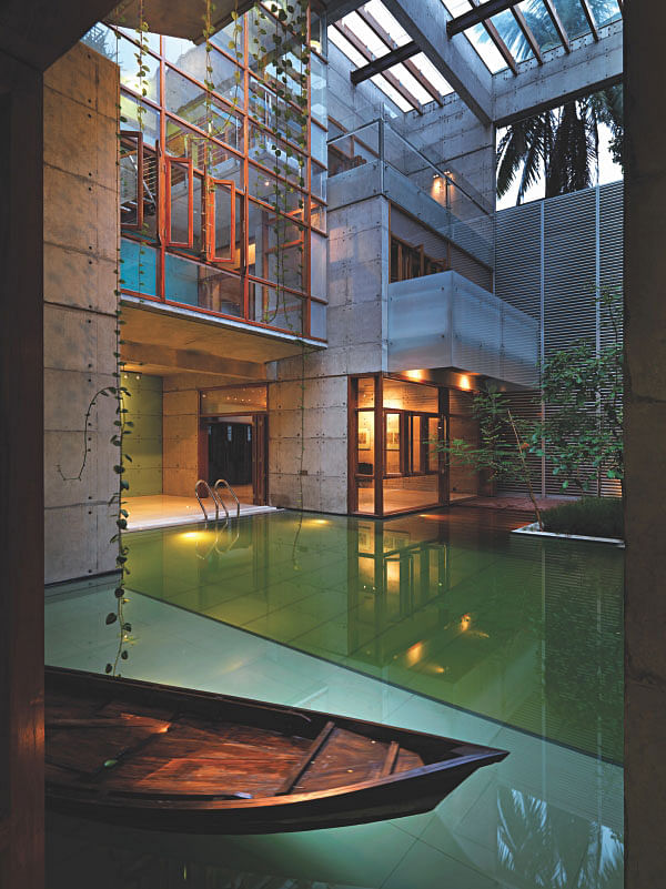 A dinghy waiting at the poolside and patches of green inside a Gulshan dwelling.