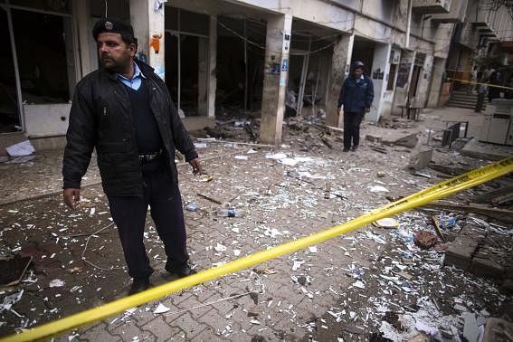 A policeman cordons off the site of a bomb attack at the district court in Islamabad March 3, 2014. Photo: Reuters.