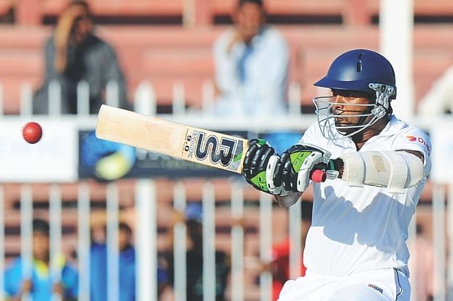 Sri Lanka batsman Dilruwan Perera plays the pull on way to scoring 95 on debut on the second day of the third Test against Pakistan at the Sharjah International Cricket Stadium yesterday. PHOTO: AFP