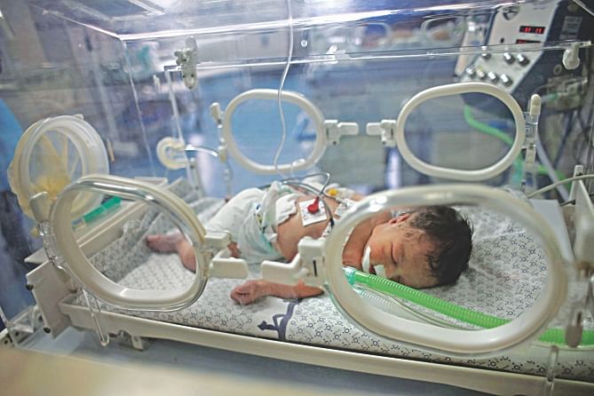 Palestinian baby girl Shayma Shiekh al-Eid lies in an incubator at a hospital in southern Gaza Strip yesterday. Doctors delivered her from the womb of her mother killed in an Israeli air strike.  Photo: Reuters
