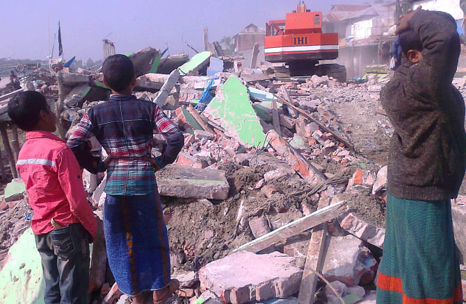 A mobile court demolished four illegal structures on Shibbaria riverside in Kalapara upazila of Patuakhali district yesterday. PHOTO: STAR