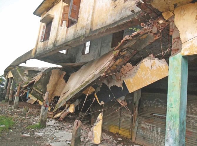 Sports activities at Patuakhali stadium are badly hampered as a portion of its front side, collapsed three years ago, still lies without repair. Photo: Star