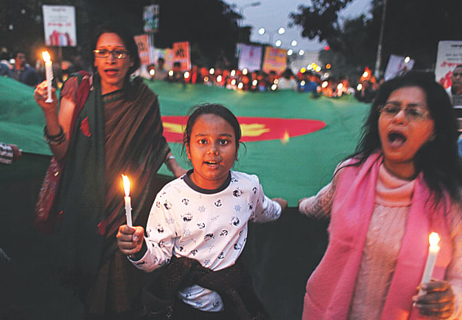 PEOPLE RISE FOR PEACE: Indignant at the killings of innocent civilians in political violence, the general public rises in protest and demands restoration of normalcy in the country yesterday. With a call for peace, people join a candlelight vigil of Gonojagoron Mancha at the capital's Shahbagh. Photo: Star