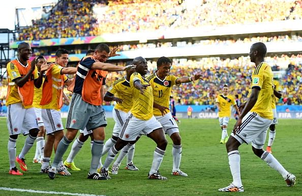Juan Guillermo Cuadrado (2nd R) of Colombia celebrates scoring his team's first goal with his teammates during the 2014 FIFA World Cup Brazil Group C match between Japan and Colombia at Arena Pantanal on June 24, 2014 in Cuiaba, Brazil. Photo: Getty Images