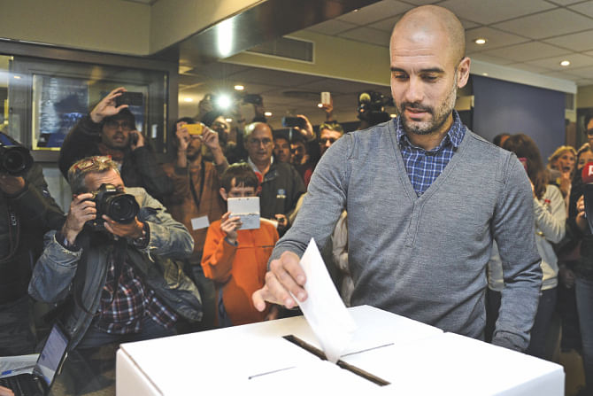 Football coach Pep Guardiola cast his ballot at a polling station in Barcelona, yesterday. Photo: AFP