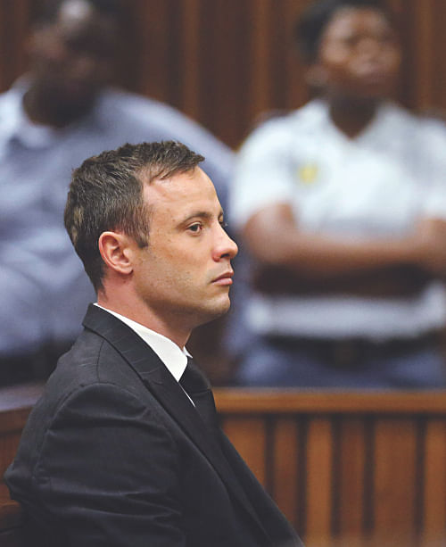 Oscar Pistorius sits forlorn in the dock as sentencing verdict is being read out at the Pretoria High Court yesterday. Photo: AFP