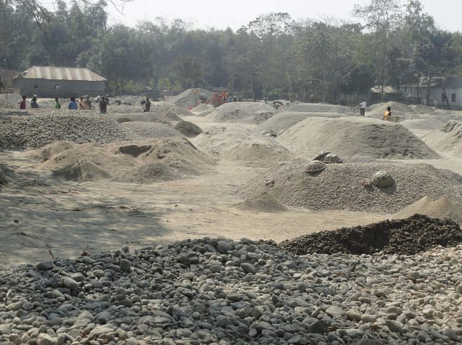 Stone traders use the playground of Hasor Uddin High School in Burimari union under Patgram upazila of Lalmonirhat for long as the managing committee of the school has leased it out. Photo: Star