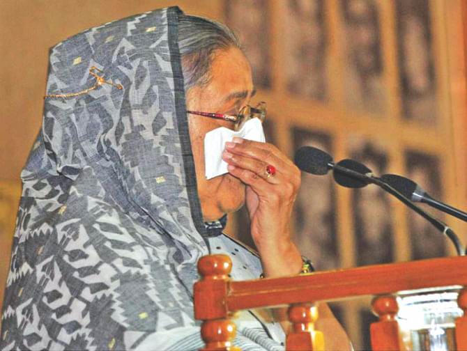 Sheikh Hasina wipes off tears while addressing a discussion on August 15 tragedy yesterday. Photo: BSS