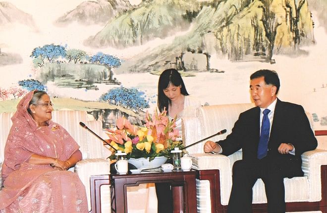 Prime Minister Sheikh Hasina meets Chinese Vice-Premier Wang Yang at Kunming International Convention and Exposition Centre in China yesterday. Photo: PID