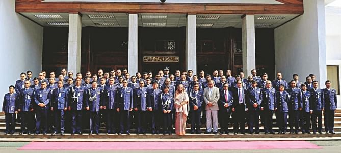 Prime Minister Sheikh Hasina poses for photographs with police high-ups at the PMO yesterday to mark the Police Week 2015. Photo: BSS