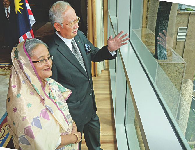 Prime Minister Sheikh Hasina with Malaysian premier Najib Razak at the latter's office in Putrajaya yesterday. Four deals were inked on the second day of Hasina's three-day visit to the country. PHOTO: PID