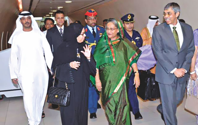 Prime Minister Sheikh Hasina reaches Abu Dhabi International Airport and is welcomed by Marriam Mohammad Khalfan Al Roomi, minister of Social Affairs of the UAE, and Muhammad Imran, Bangladesh ambassador to the UAE yesterday.  Photo: PID
