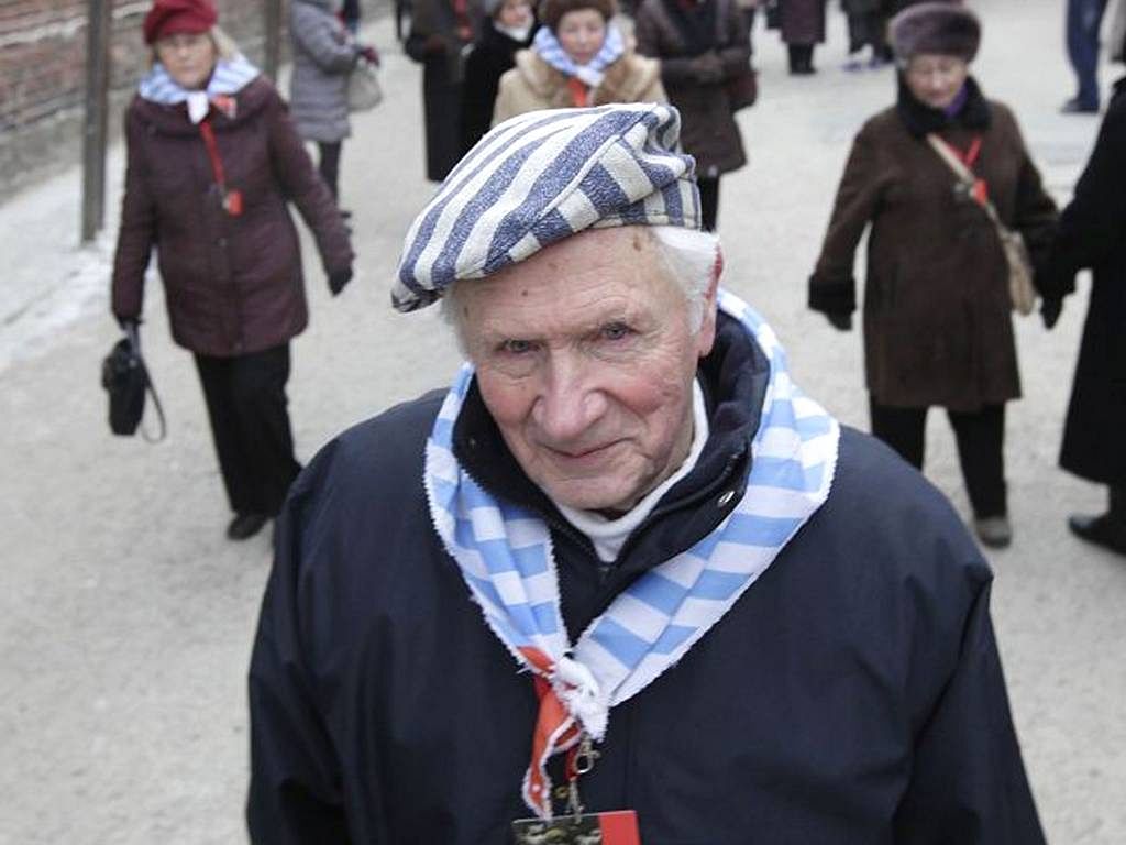 A Holocaust survivor walks inside the former concentration camp before a ceremony to mark the 69th anniversary of the liberation of Auschwitz Nazi death camp's in Oswiecim. Photo: AP
