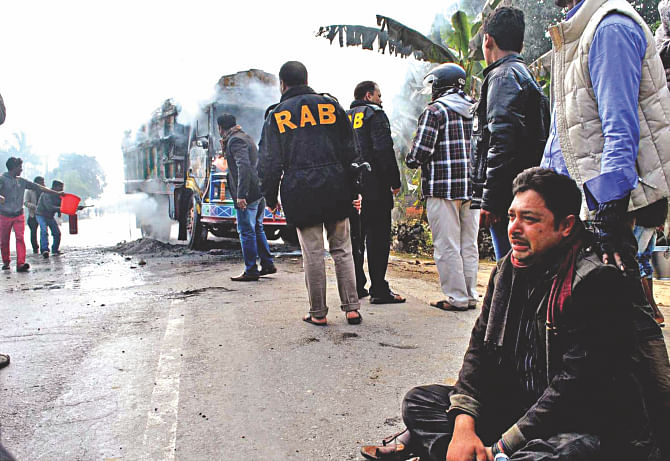 Ratan just sits on the highway and sobs, right. Allegedly blockade supporters had scattered a flammable powder on his truck and set the vehicle on fire. Photo: Star