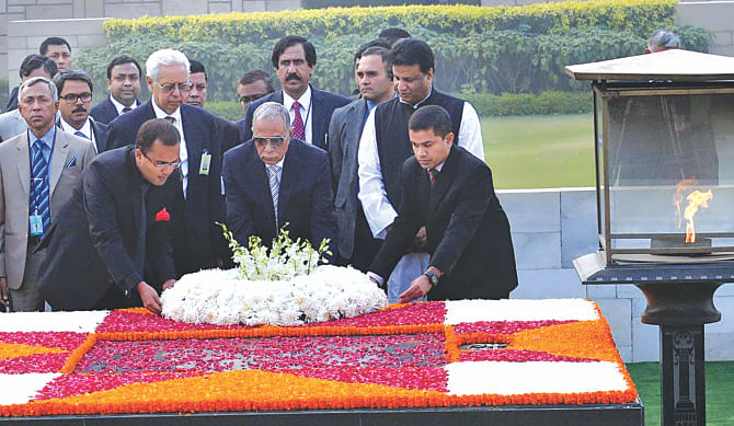 President Abdul Hamid places a floral wreath at the memorial of Mahatma Gandhi in Rajghat yesterday. The president is on a six-day visit to India. Photo: PID