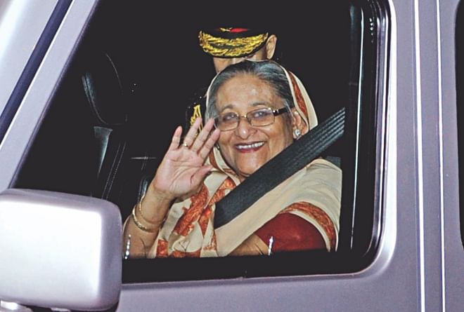 Prime Minister Sheikh Hasina waves at the crowds on her way to the Gono Bhaban on her return from China yesterday.  Photo: BSS/ Sk Enamul Haq