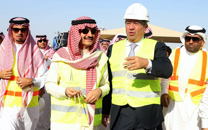 Third from left, Saudi billionaire owner of Kingdom Holding Company Prince Alwaleed bin Talal visits the location of the Kingdom Tower and the Kingdom City in Obhor, 30 kilometres north of Jeddah City, on Tuesday. Photo: AFP